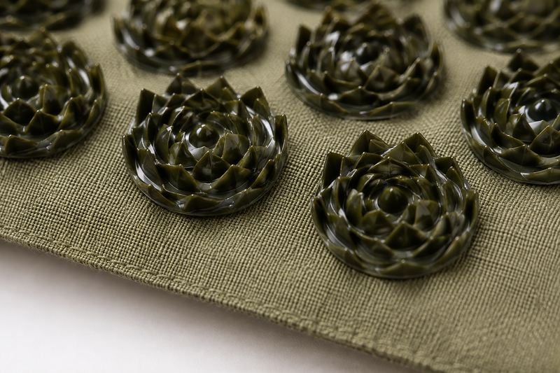 Close-up of the lotus-shaped acupressure points on the Equaza Premium Linen Acupressure Mat.
